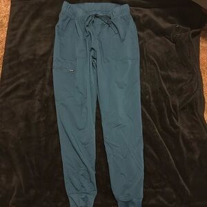 Blue scrubs Top is M and Bottoms are size L
